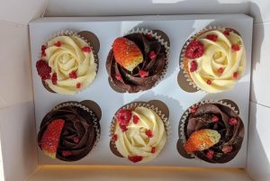 white and brown cupcakes with strawberries